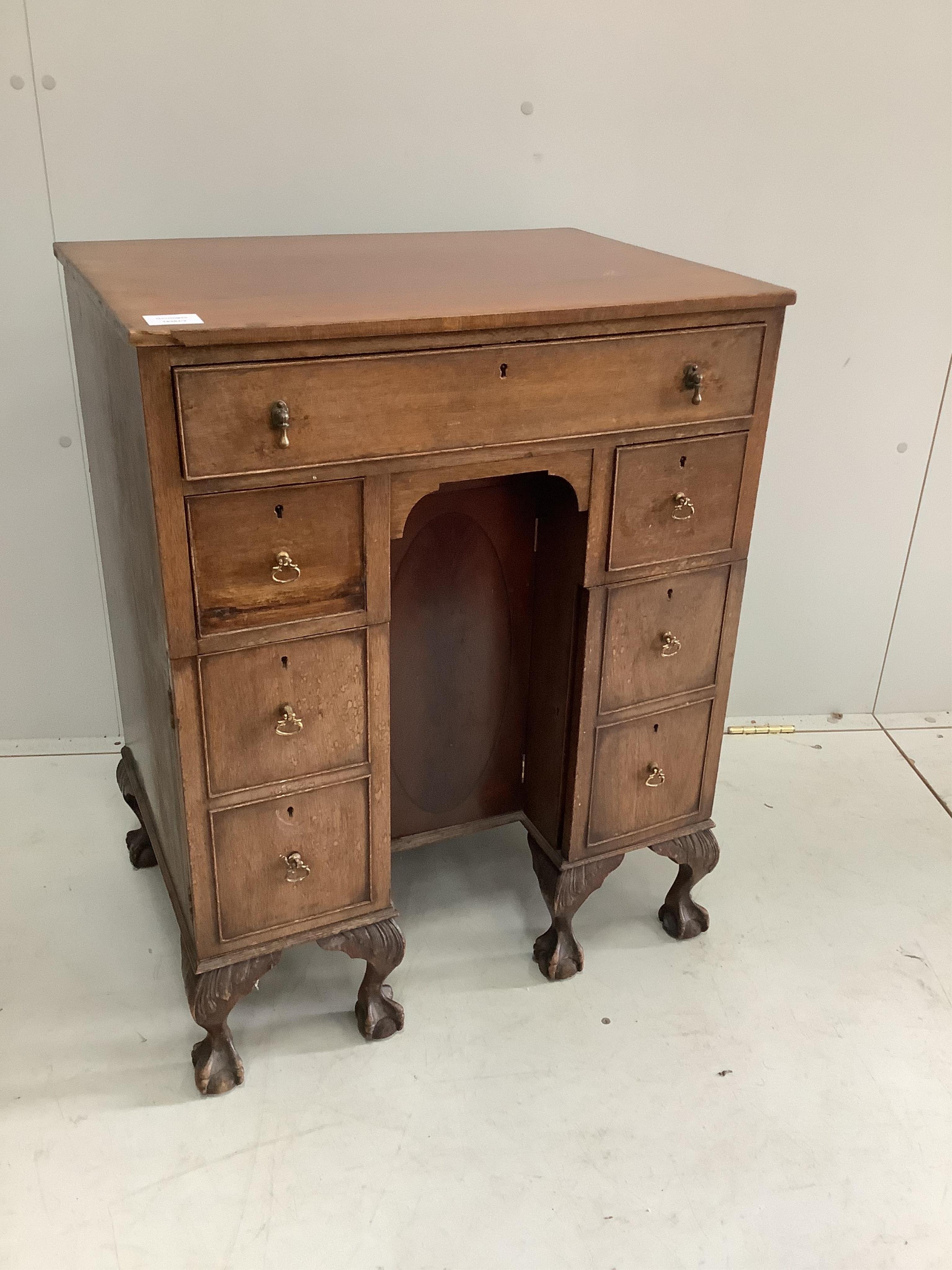 A small George III style mahogany kneehole desk, width 61cm, depth 43cm, height 77cm. Condition - poor to fair